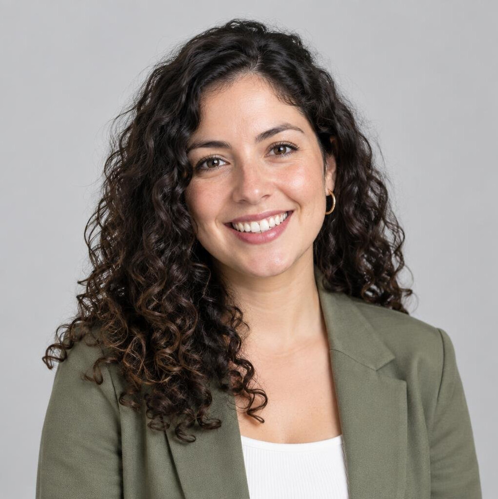 Studio portrait of a young Chilean woman with curly hair