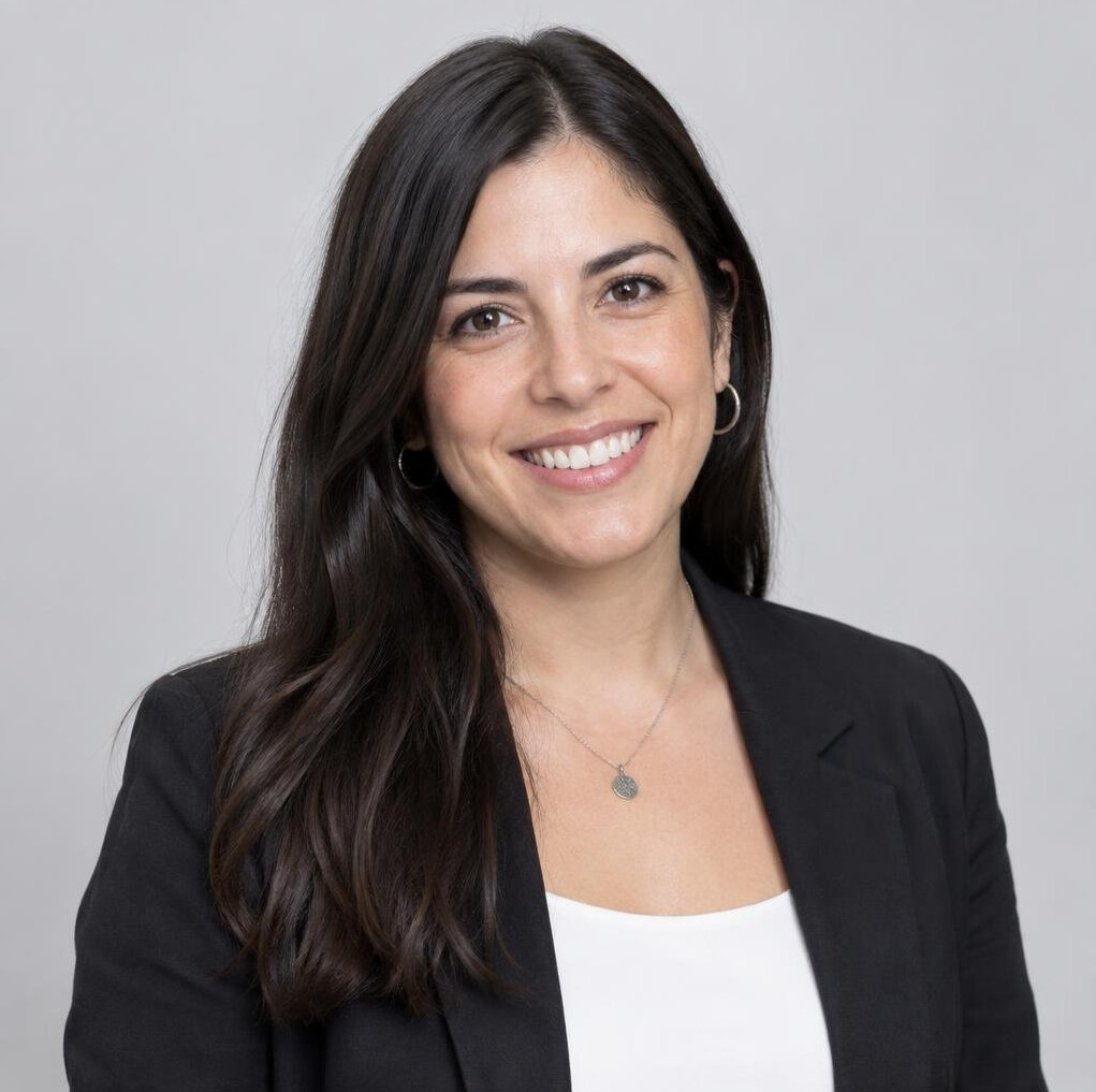 Studio portrait of a Chilean woman with dark hair smiling